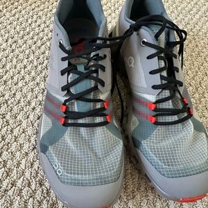 On Running Gray and Red Athletic Shoes